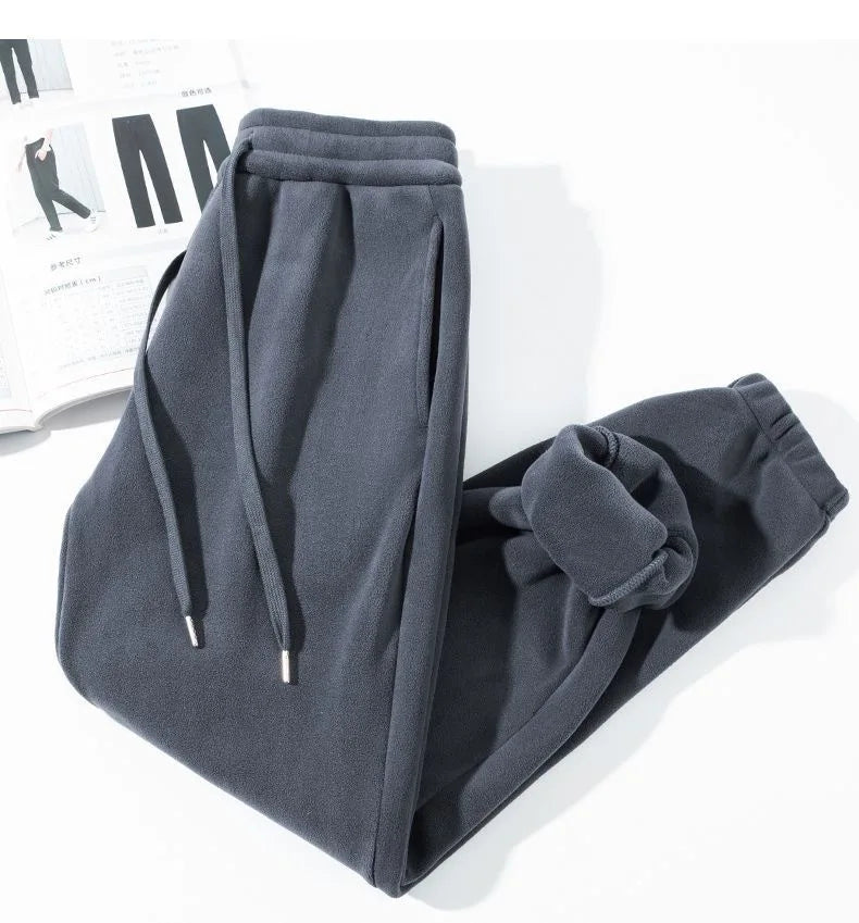 Pantalones para hombres con forro de felpa, para invierno, gruesos, duraderos, con puños, moda juvenil, ajuste suelto, talle medio-alto, pantalones largos