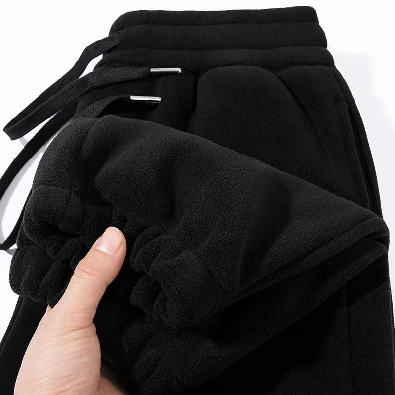 Pantalones para hombres con forro de felpa, para invierno, gruesos, duraderos, con puños, moda juvenil, ajuste suelto, talle medio-alto, pantalones largos
