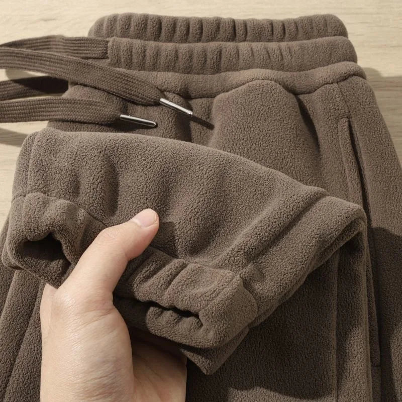 Pantalones para hombres con forro de felpa, para invierno, gruesos, duraderos, con puños, moda juvenil, ajuste suelto, talle medio-alto, pantalones largos