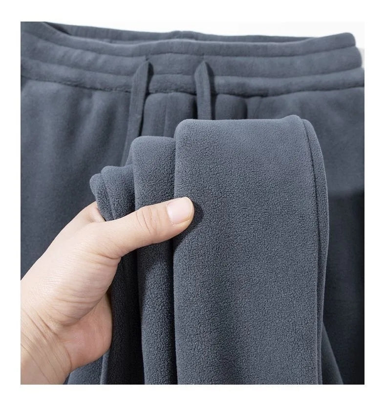 Pantalones para hombres con forro de felpa, para invierno, gruesos, duraderos, con puños, moda juvenil, ajuste suelto, talle medio-alto, pantalones largos