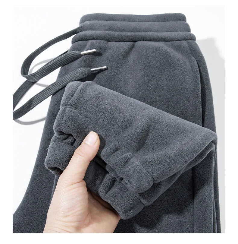 Pantalones para hombres con forro de felpa, para invierno, gruesos, duraderos, con puños, moda juvenil, ajuste suelto, talle medio-alto, pantalones largos