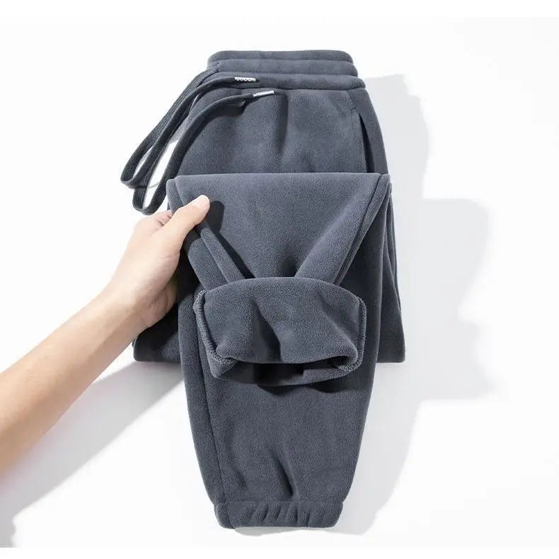 Pantalones para hombres con forro de felpa, para invierno, gruesos, duraderos, con puños, moda juvenil, ajuste suelto, talle medio-alto, pantalones largos